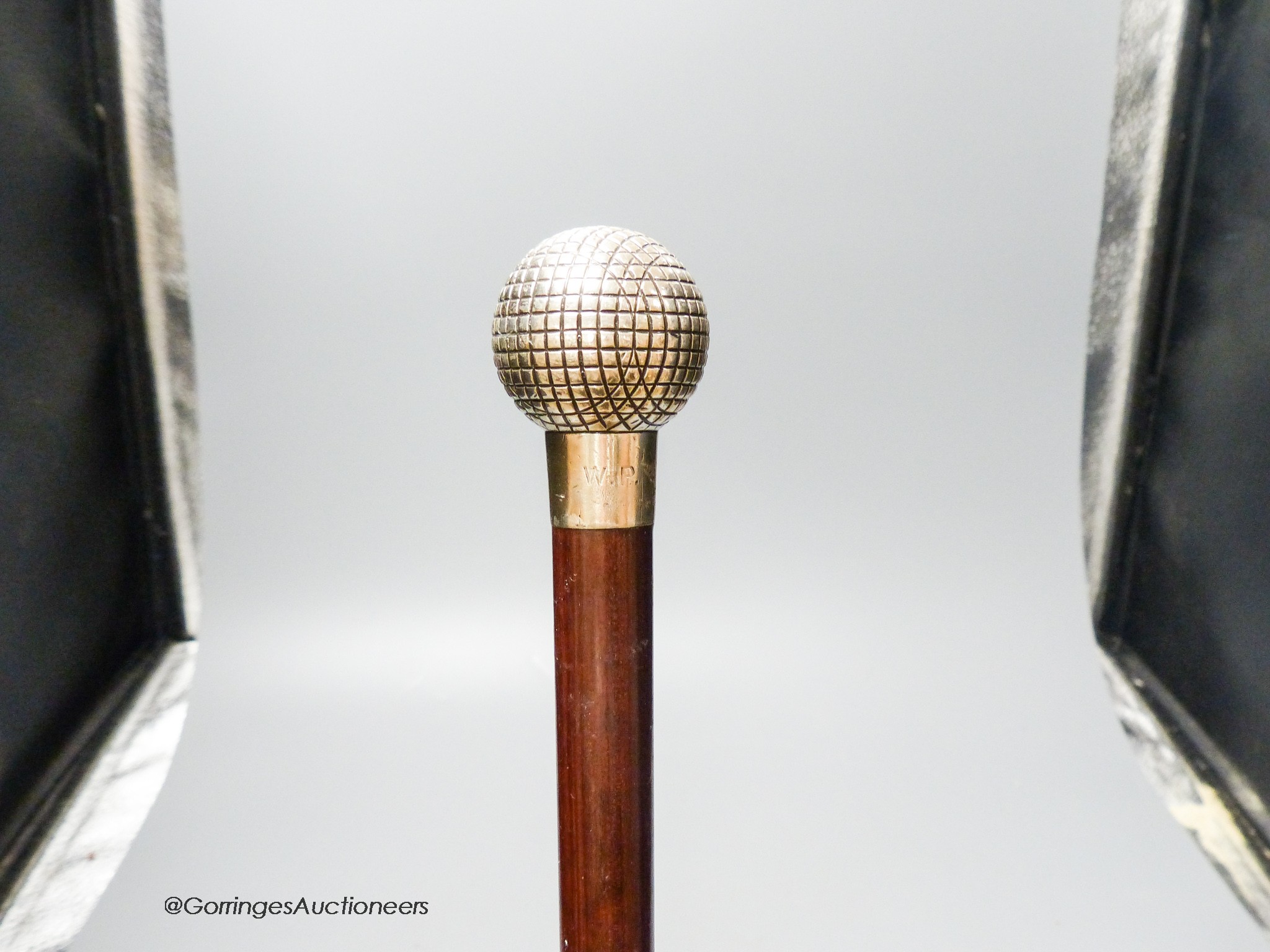 A Briggs silver topped 'golf ball' walking cane, London 1913